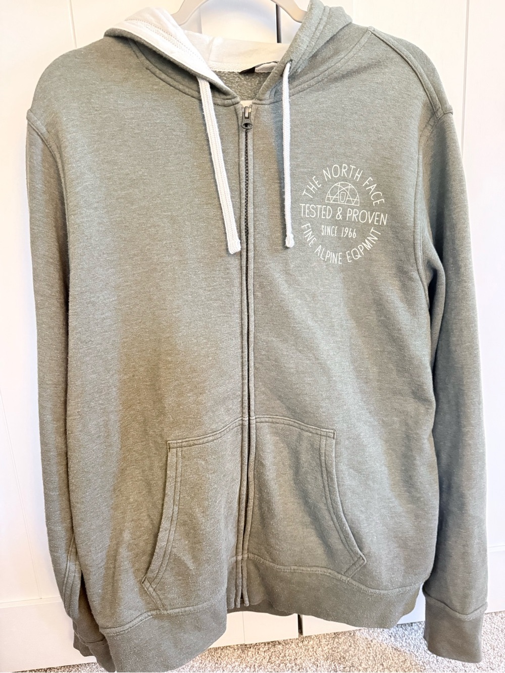The North Face Olive Green Zip-Up Hoodie with White Drawstrings